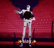 a man in a dalmatian costume is dancing on a stage in front of a crowd .