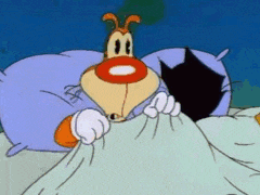 a cartoon dog is laying under a blanket next to a black cat .