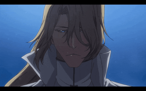 a man with long blonde hair is wearing a white coat