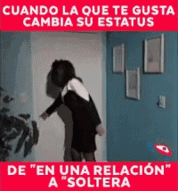 a woman is standing in front of a door with a caption that says cuando la que te gusta cambia su status