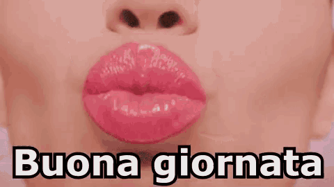 a close up of a woman 's mouth with pink lips and the words buona giornata written below her .