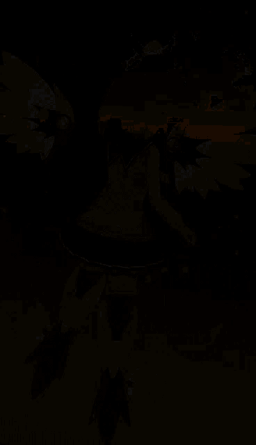 a girl with wings is standing in front of a dark background