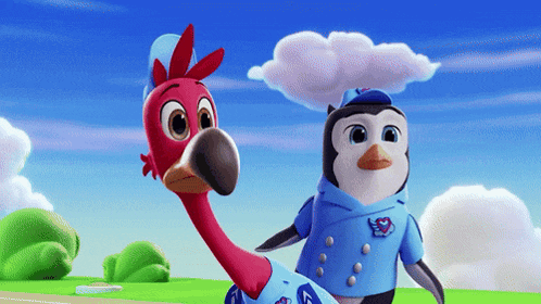 a penguin and a flamingo are standing next to each other in a field
