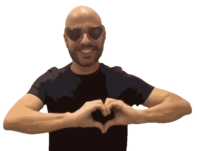 a bald man wearing heart shaped sunglasses is making a heart shape with his hands