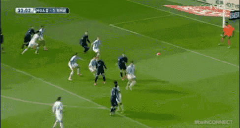 a soccer goalie holds a sign that says bbva in front of a goal