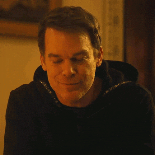 a close up of a man 's face with a smile