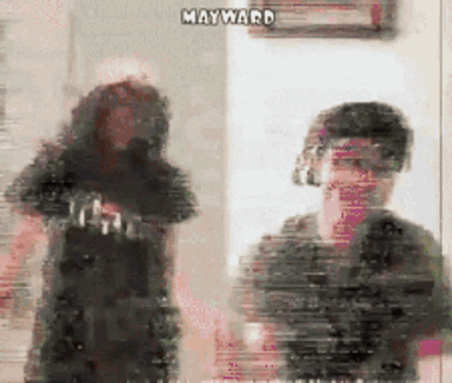 a blurry picture of a man and a woman with mayward written on the bottom
