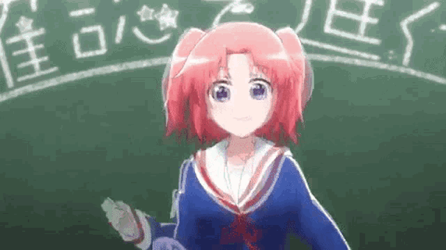 a girl with red hair is standing in front of a blackboard with chinese writing on it .
