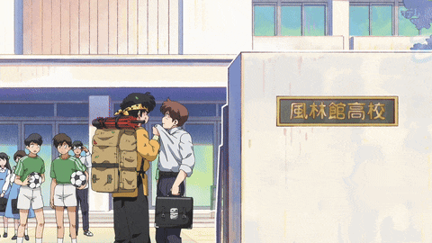 a group of people standing in front of a building with a sign that says ' 風林 館 高校 '