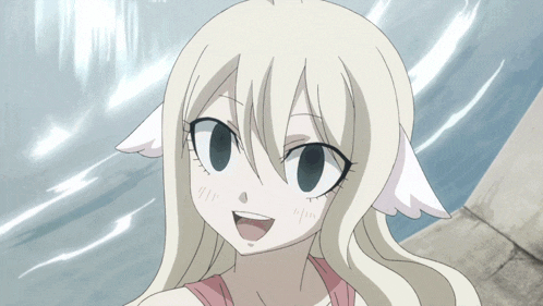 a close up of a girl 's face with a smile on her face