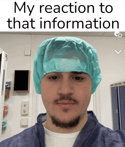 a man with a beard wearing a blue surgical cap with the caption my reaction to that information