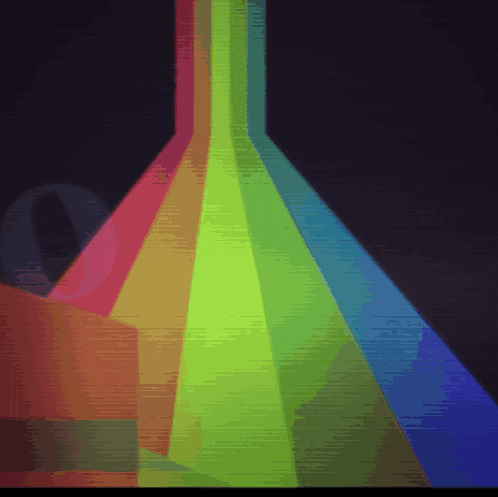 a rainbow of colors is displayed in a dark room