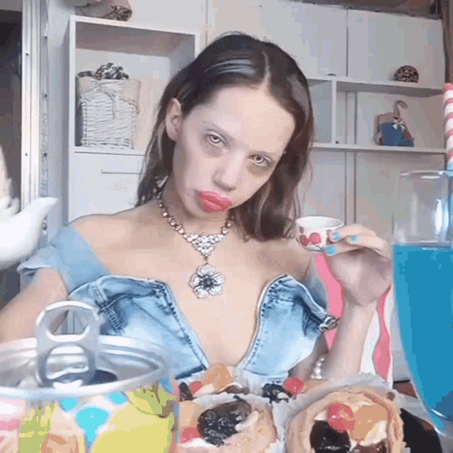 a woman sitting at a table with a can opener