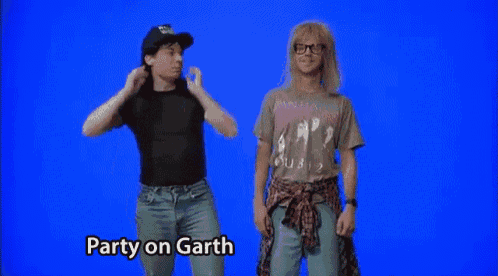 two men are standing next to each other and one of them is wearing a shirt that says ' party on garth ' on it
