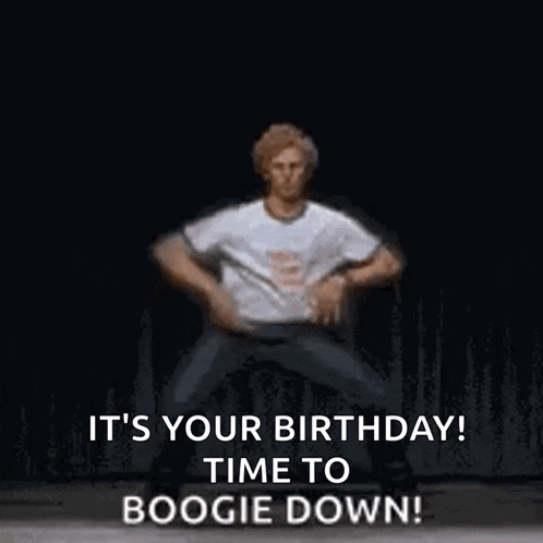 a man in a white shirt is dancing on a stage .