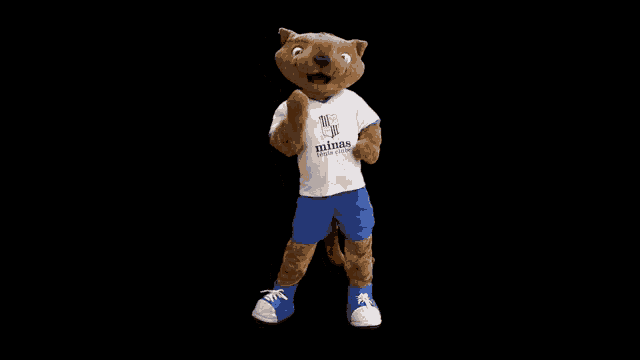 a mascot wearing a white shirt that says minas
