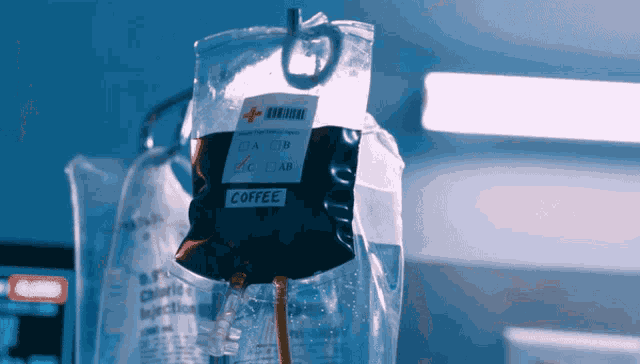 a bag of coffee is attached to a drip in a hospital room