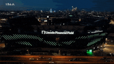 an aerial view of the lincoln financial field lit up at night