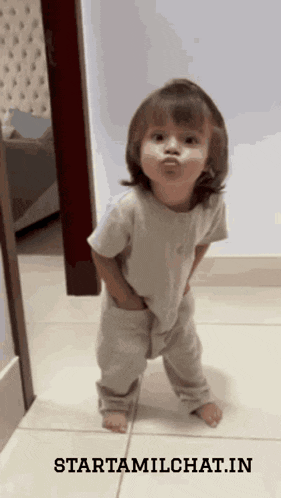 a little girl standing on a tiled floor with the words starttamilchat.in written on the bottom