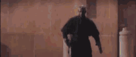 a person is holding a lightsaber in a room with a lot of lightsabers coming out of it .
