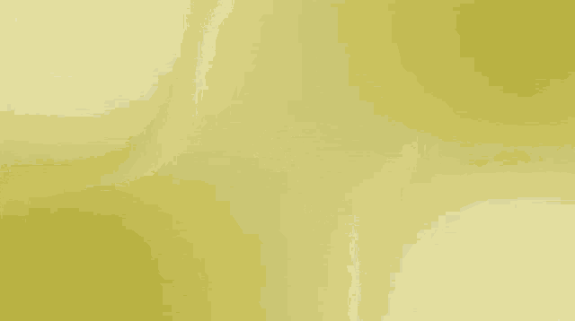 a yellow background with a white circle in the middle of it