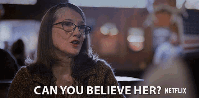 a woman wearing glasses says " can you believe her "