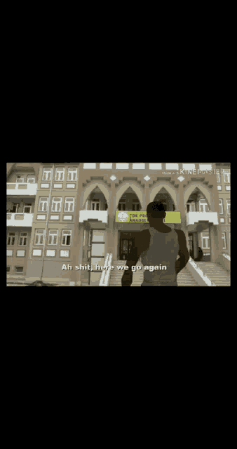 a man standing in front of a building with the words ah shit here we go again on the bottom