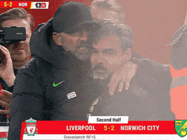 a soccer game between liverpool and norwich city is being played