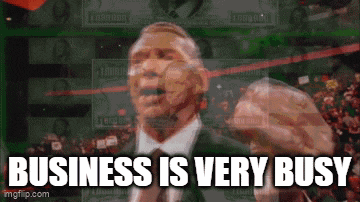 a man in a suit and tie is giving a speech with the words business is very busy below him