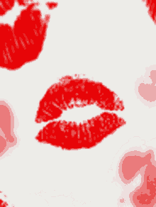 a white background with red lipstick prints on it