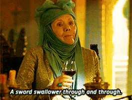 a woman holding a glass of wine with the words a sword swallower through and through