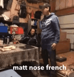 a man standing in a garage with the words matt nose french written on the bottom