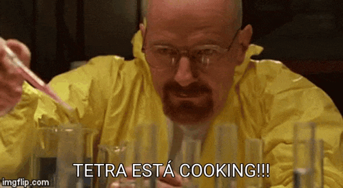 a man in a yellow protective suit is cooking and says tetra esta cooking !!!