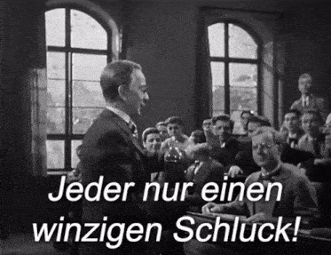a black and white photo of a man talking to a group of people with the words jeder nur einen winzigen schluck