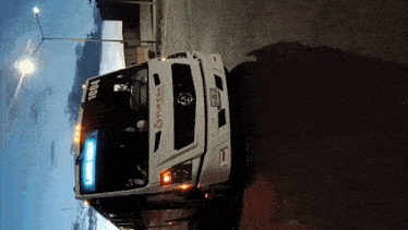a white truck with the number 1004 on the front