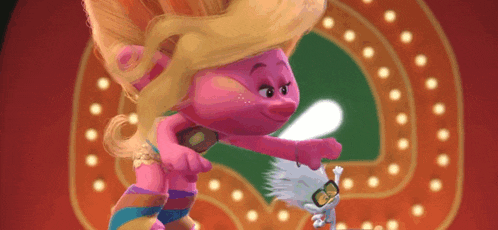 a troll with blonde hair is standing next to another troll .