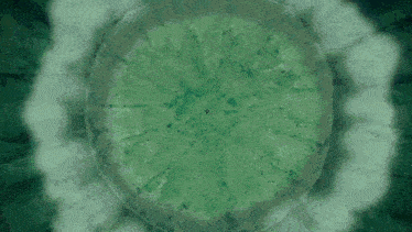 a green circle with a white light in the center