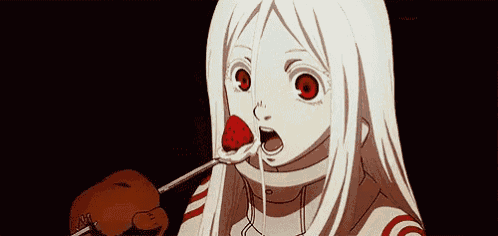 a girl with white hair and red eyes is eating a strawberry with a spoon .