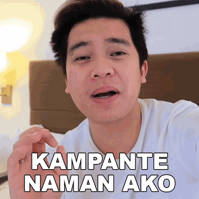 a man in a white shirt is making a funny face and says kampante naman ako