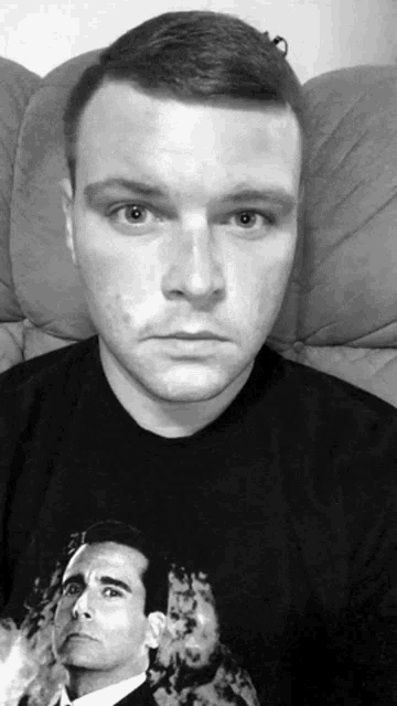 a man wearing a t-shirt with a picture of a man on it
