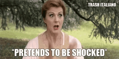 a woman with a shocked look on her face and the words pretends to be shocked below her