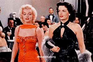 two women standing next to each other with a caption that says vogue young