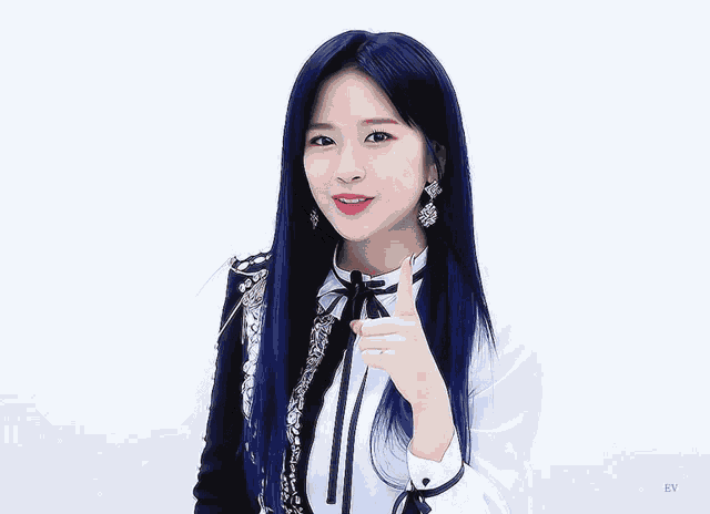 a woman with blue hair is wearing a white shirt with a black jacket