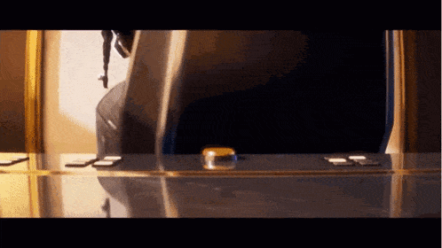 a yellow object is sitting on a table next to a number 3