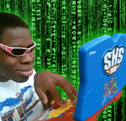 a man wearing sunglasses is playing a shs game on a computer