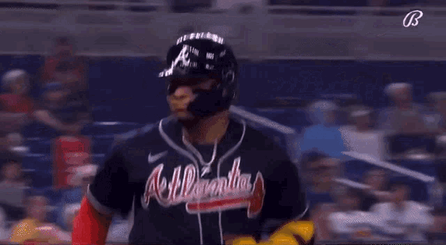 a baseball player wearing a jersey with the number 44 on the back