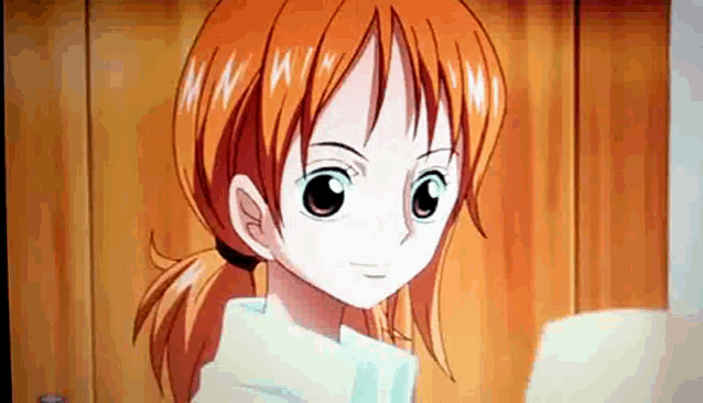 a close up of a cartoon character with orange hair and a white shirt .
