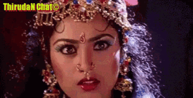a close up of a woman 's face with the words thiruda chat in the corner