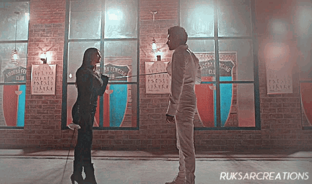 a man and a woman are standing in front of a brick building with a sign that says ' masters club '