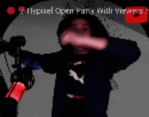 a person is standing in front of a microphone with the words flypixel open party with viewers on the bottom